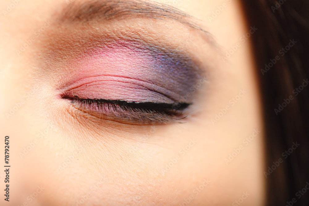 Naklejka premium Part of woman face eye with eyeshadow makeup detail.