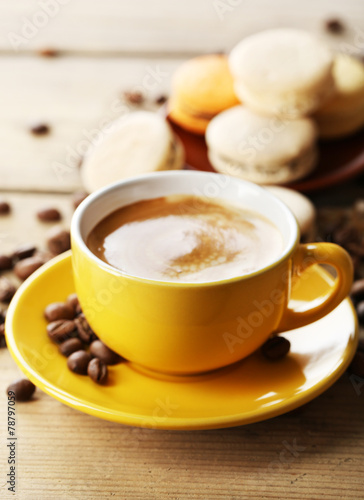 Gentle colorful macaroons and coffee in mug