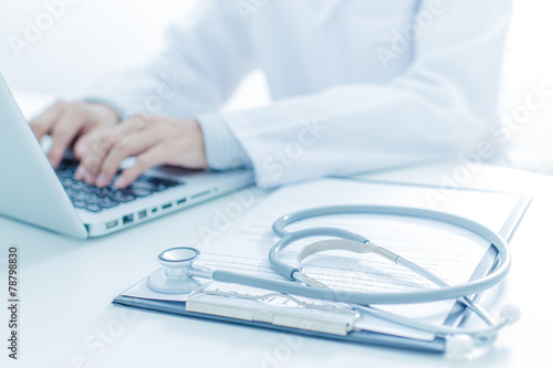 Close-up of a medical worker with laptop