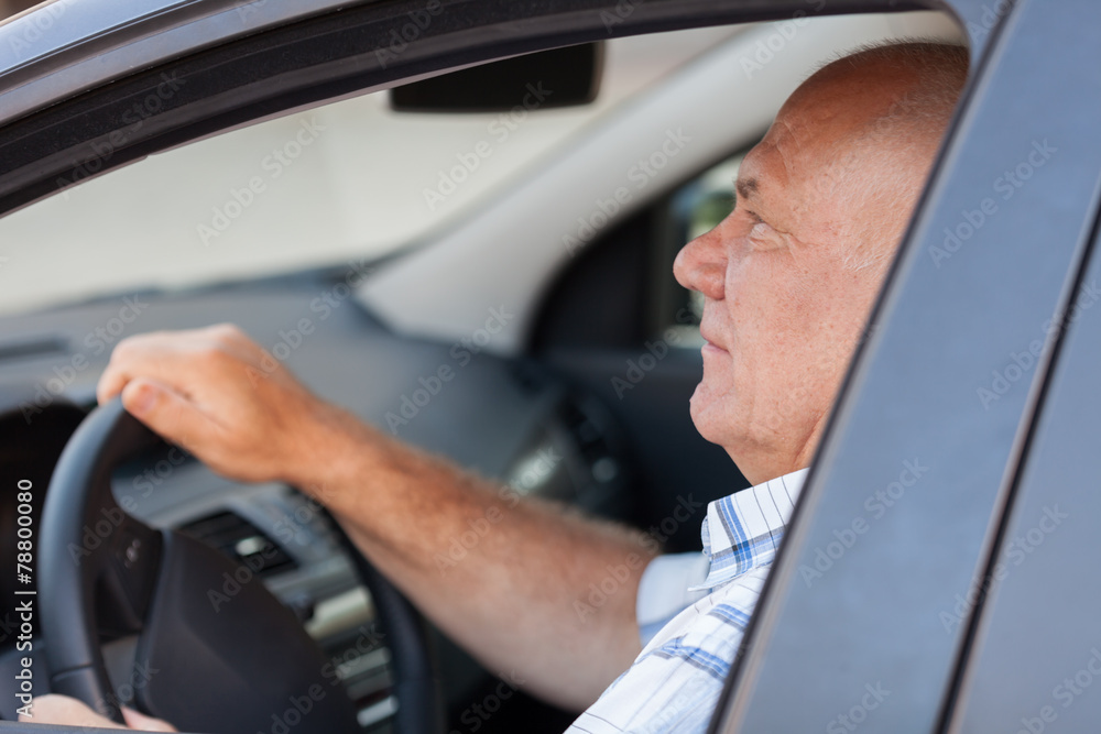 man sitting in   car.