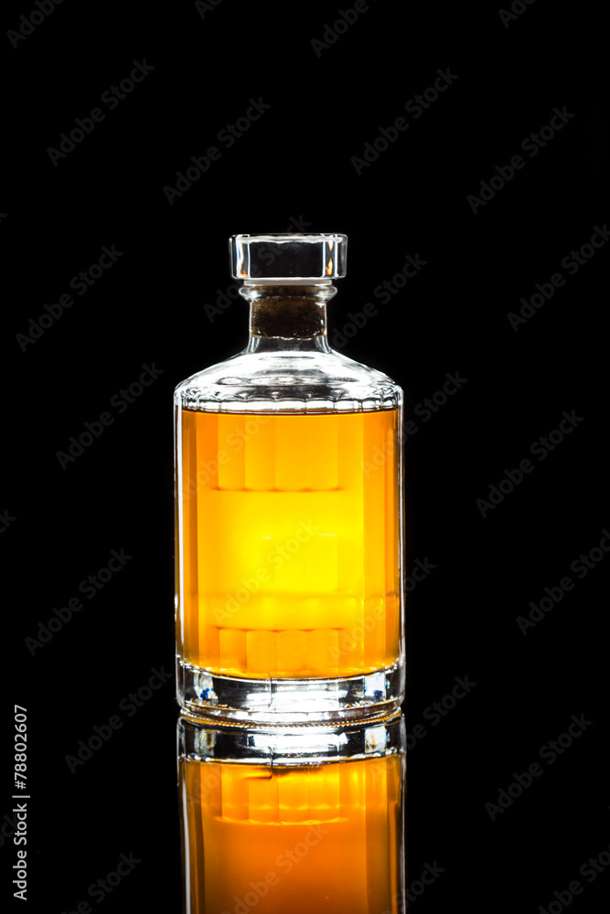 whiskey bottle in dark background whiskey bottle in dark background
