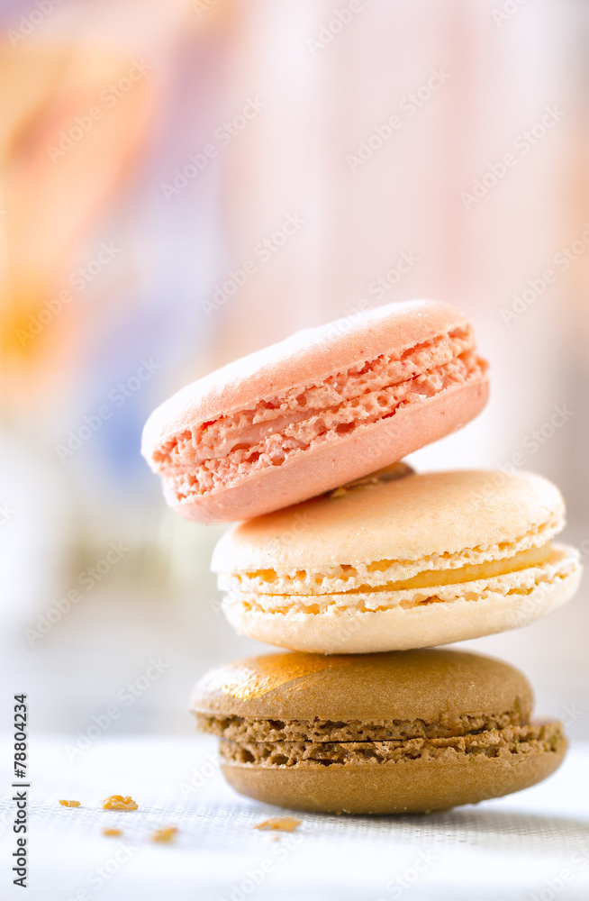Macaroon cookies in a stack of three with selective focus and ba