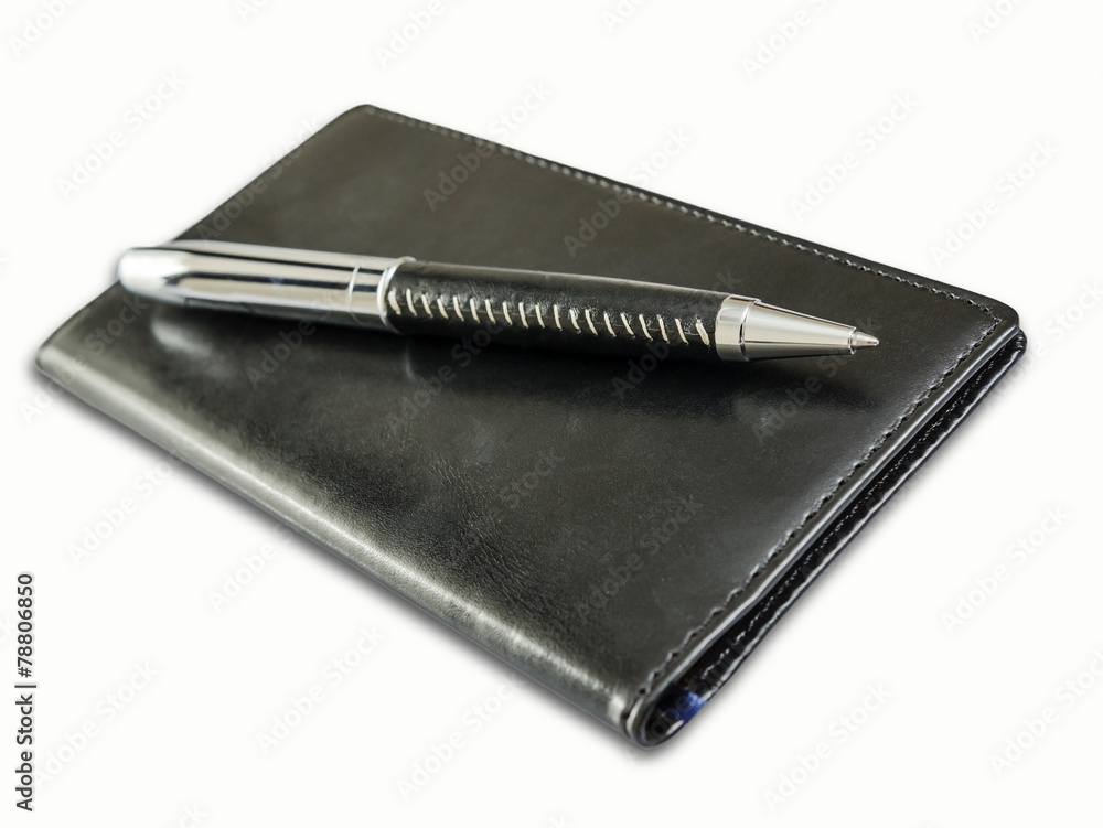 Ballpoint pen on black note book Ballpoint pen on black note book
