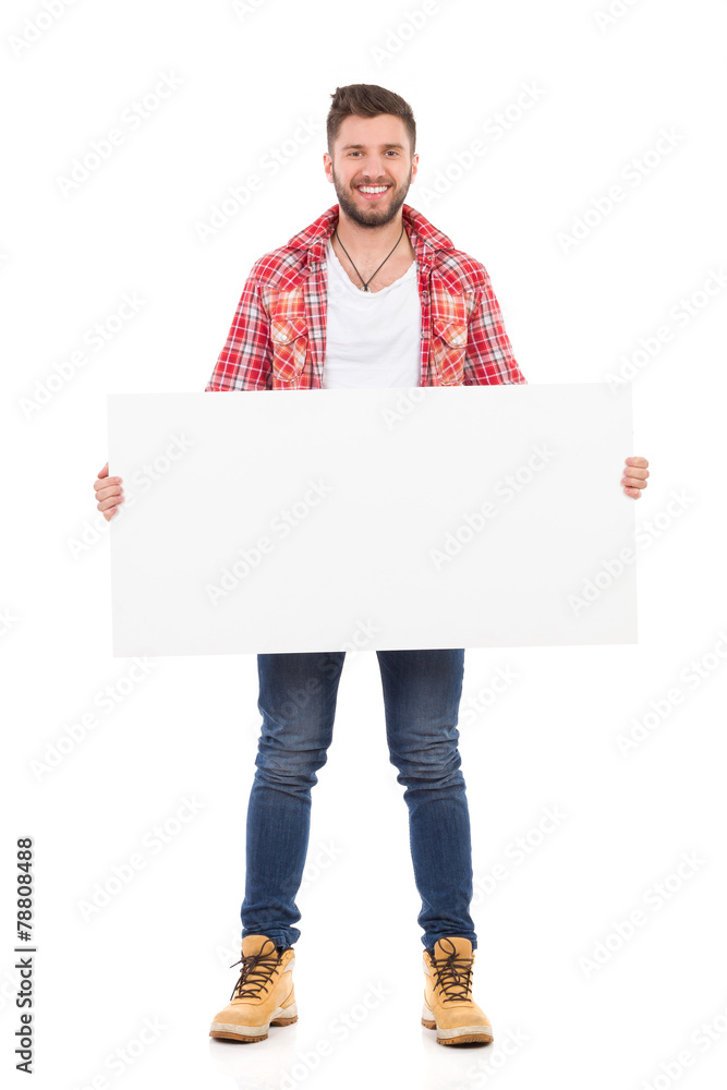 Smiling man holding placard Smiling man holding placard