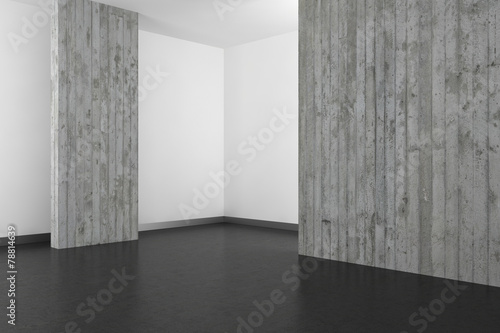 empty modern bathroom with concrete wall and dark floor