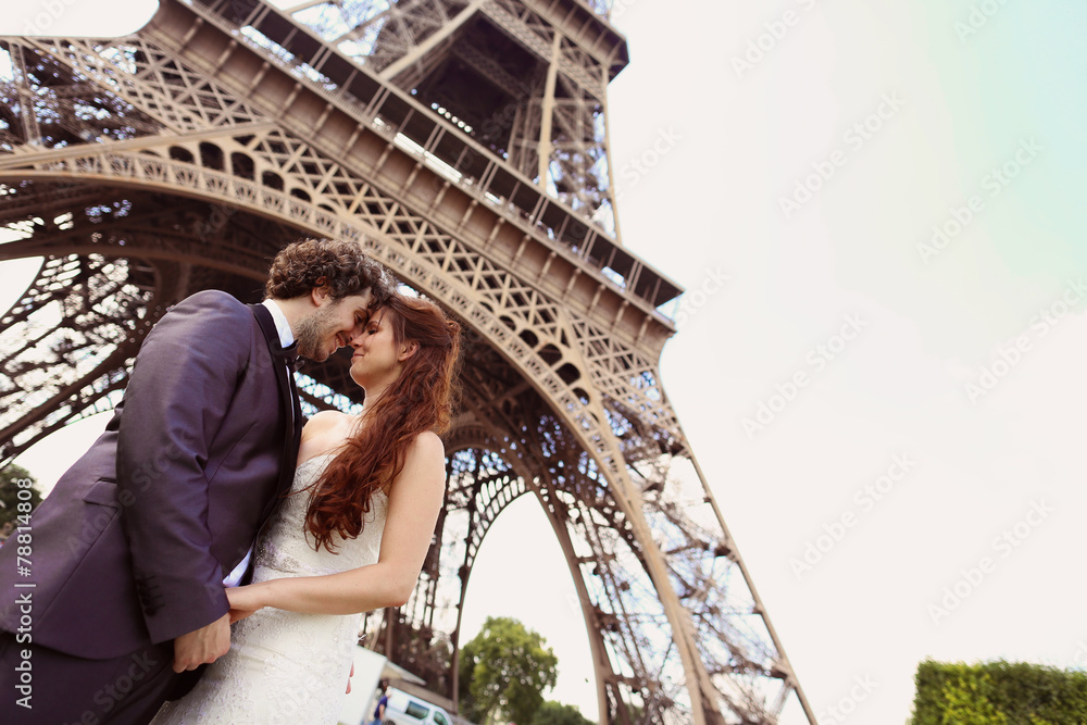 Bride and groom near Eiffel tower