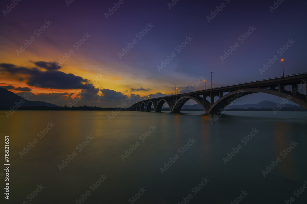Fototapeta premium A Wonderful and Colorful Nice Sunset Behind The Bridges