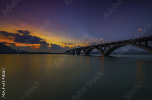 A Wonderful and Colorful Nice Sunset Behind The Bridges