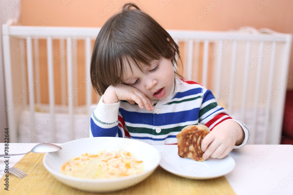 boy eating soup