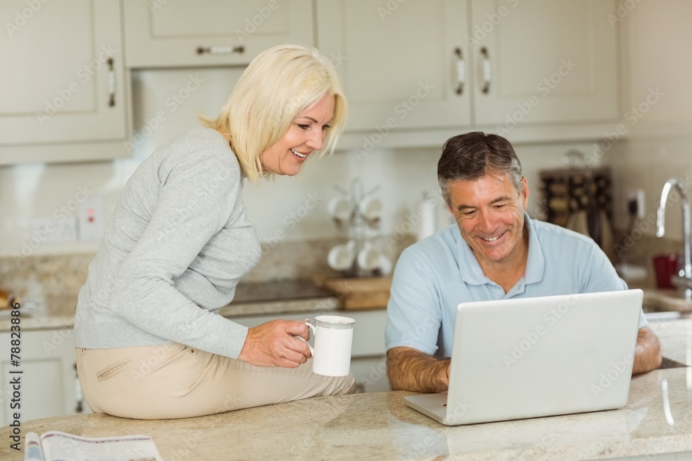 Happy mature couple using laptop Happy mature couple using laptop