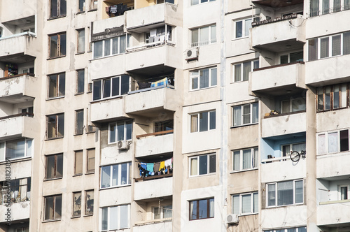 Large obsolete residential block in poor neighborhood © varbenov