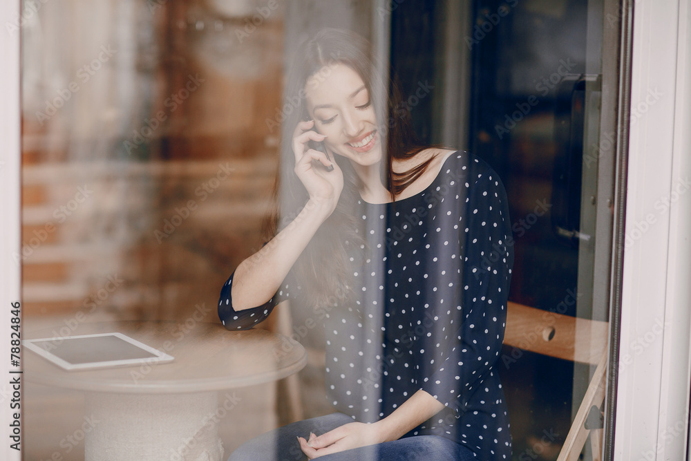 beautiful young girl enjoys phone and tablet beautiful young girl enjoys phone and tablet
