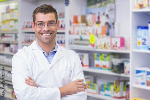 Handsome pharmacist smiling at camera photo