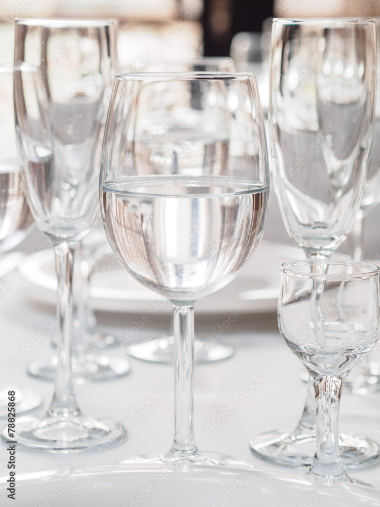 Glasses and plates on table in restaurant Glasses and plates on table in restaurant