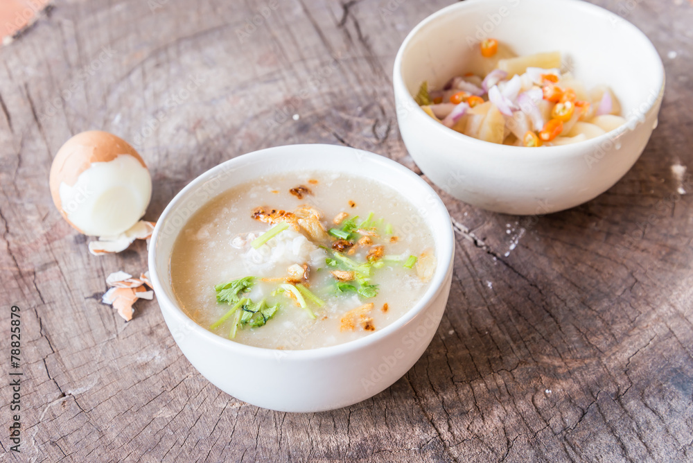 Bowl of oats porridge on wooden table. Healthy breakfast Bowl of oats porridge on wooden table. Healthy breakfast
