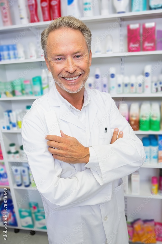 Senior pharmacist smiling at camera Senior pharmacist smiling at camera