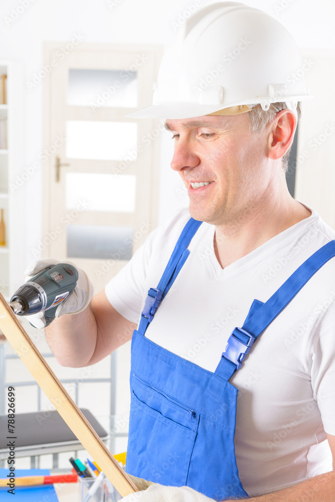 Man with wireless electric drill Man with wireless electric drill