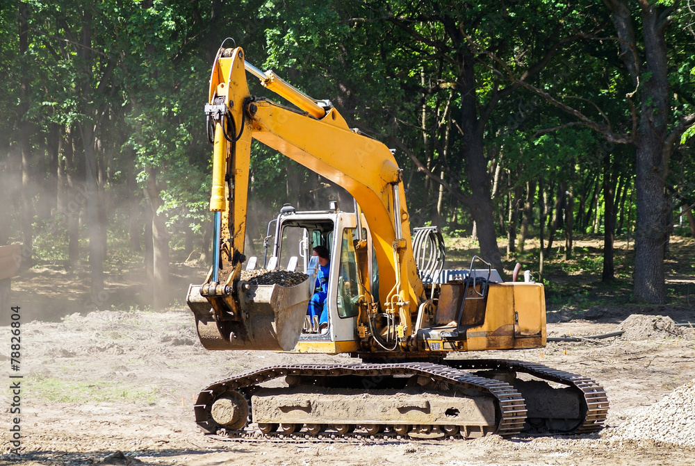 Excavator is working at the construction site Excavator is working at the construction site
