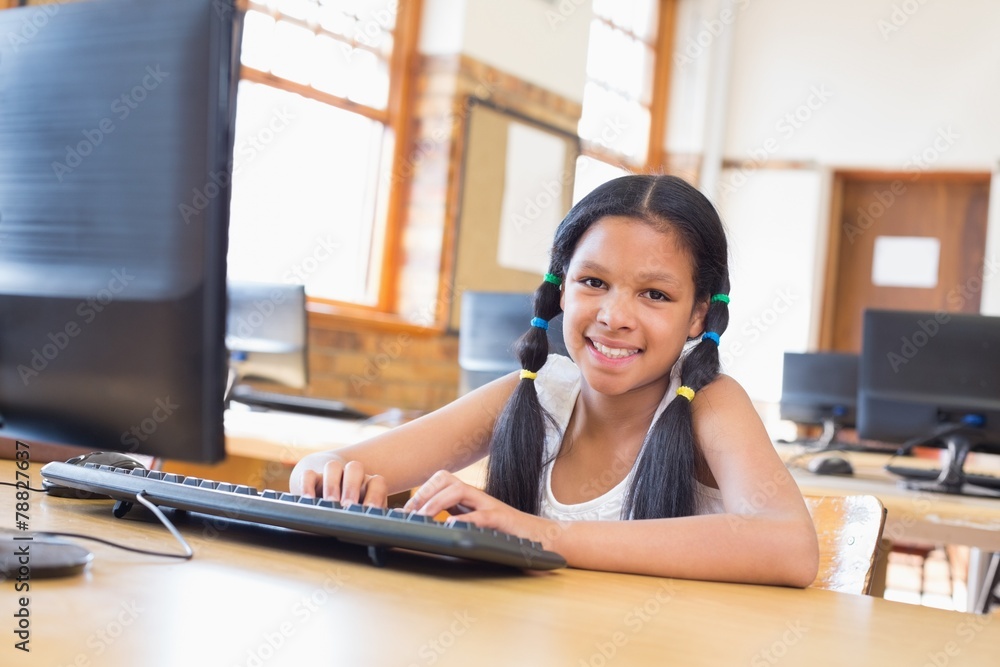 Obraz premium Cute pupil in computer class