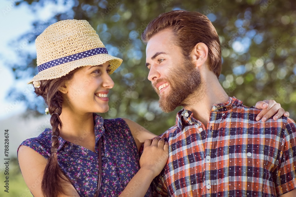 Hipster couple smiling at each other Hipster couple smiling at each other