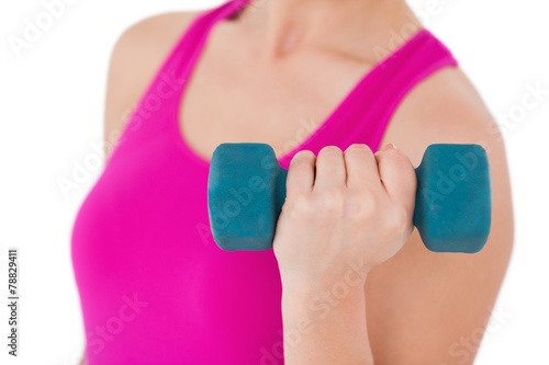 Fit woman with blue dumbbell