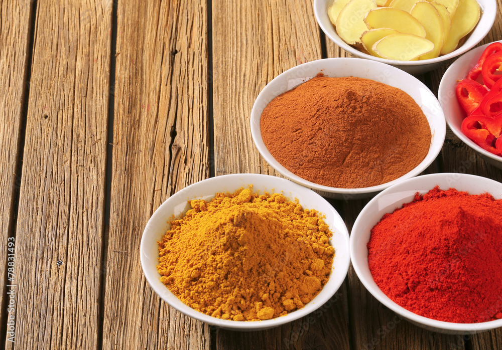 Curry powder, paprika, ground cinnamon, sliced ginger root and Curry powder, paprika, ground cinnamon, sliced ginger root and