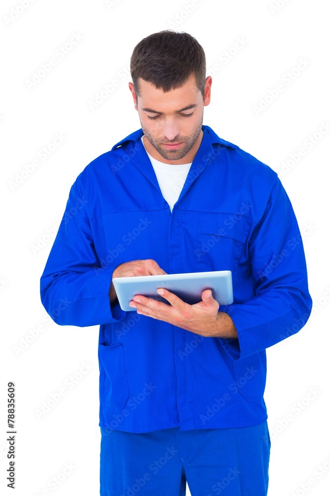Mechanic using digital tablet on white background Mechanic using digital tablet on white background