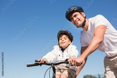 Father and son on a bike ride © WavebreakmediaMicro