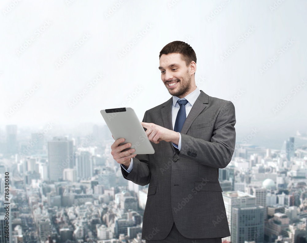 smiling buisnessman with tablet pc computer smiling buisnessman with tablet pc computer