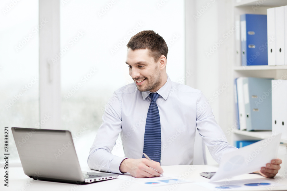 smiling businessman with laptop and documents smiling businessman with laptop and documents