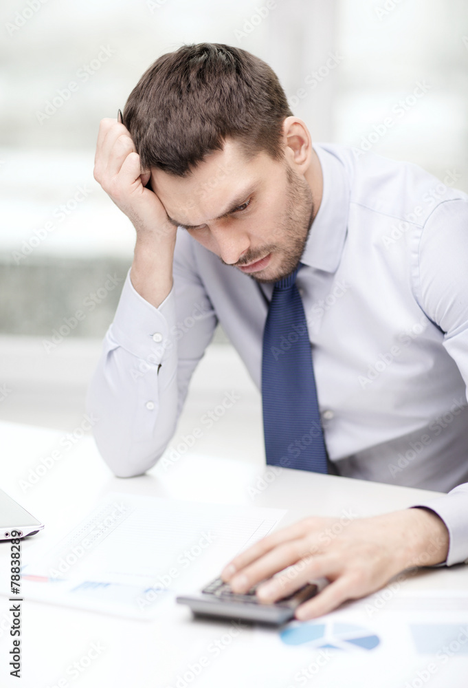 stressed businessman with laptop and documents stressed businessman with laptop and documents