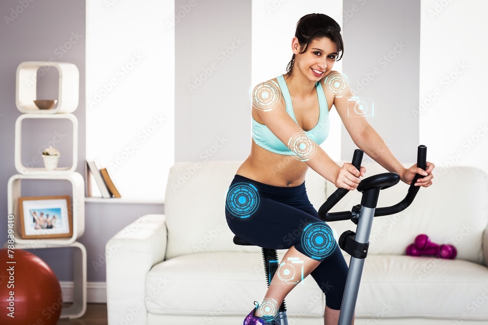 Composite image of fit brunette working out on exercise bike Composite image of fit brunette working out on exercise bike