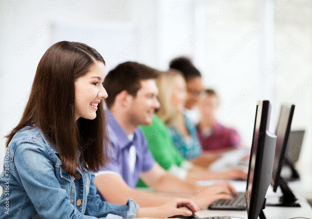 students with computers studying at school students with computers studying at school