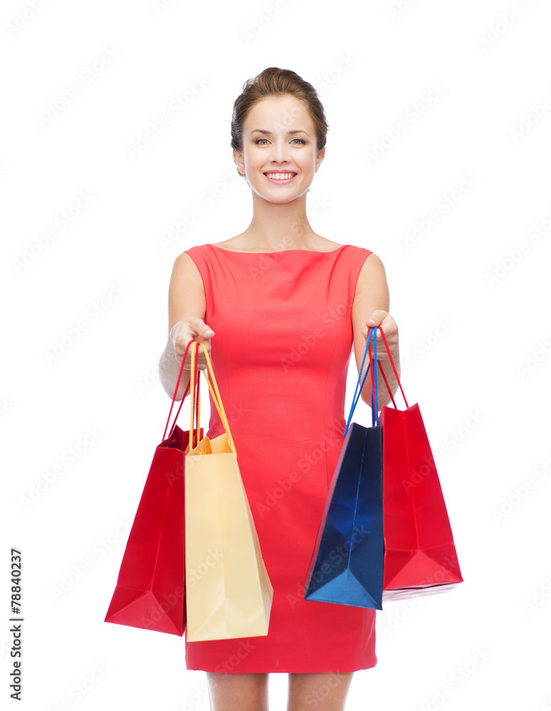 smiling elegant woman in dress with shopping bags smiling elegant woman in dress with shopping bags