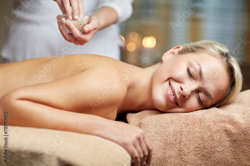 close up of woman lying and having massage in spa