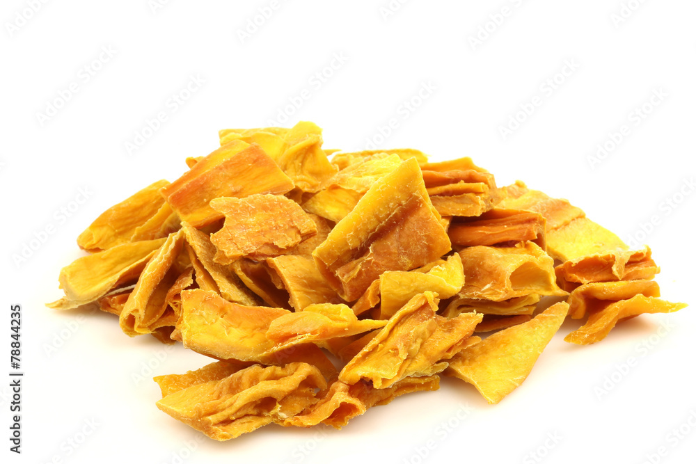 colorful pieces of dried mango fruit on a white background - obrazy, fototapety, plakaty 