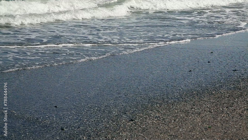 Walking person in beach sand shore at summer vacation Walking person in beach sand shore at summer vacation