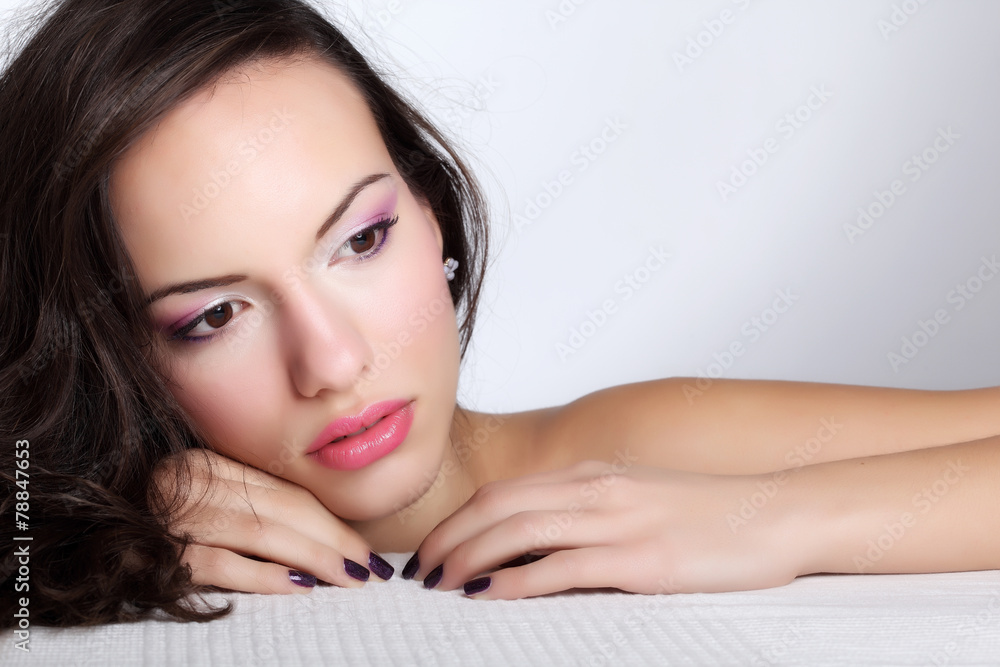 Obraz premium Portrait of young beautiful woman with fashion makeup