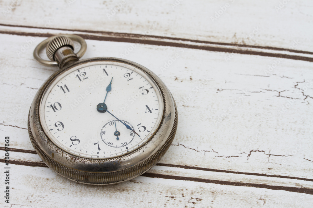 Old pocket watch on wood background Old pocket watch on wood background
