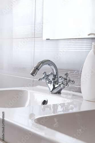Steel faucet in a bathroom