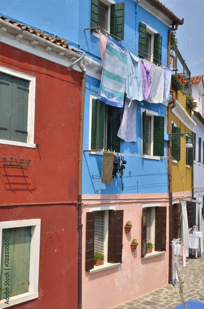 Laundry on blue house in Burano, Venice, Italy