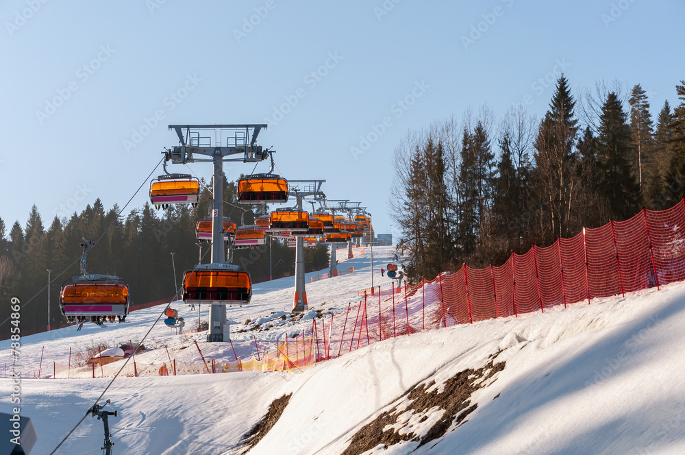 Naklejka premium Ski slope and modern chair ski lift