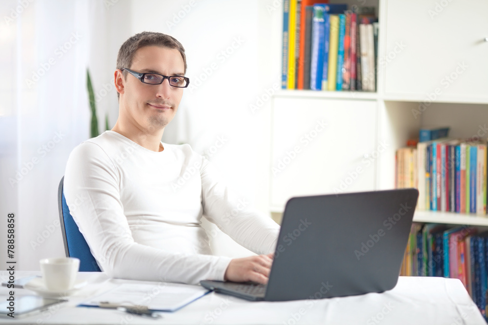 Portrait of young businessman working at home Portrait of young businessman working at home