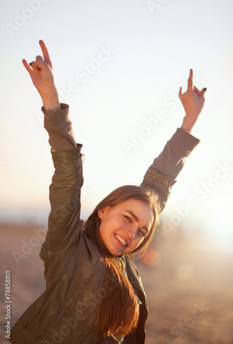 Girl shows sign of the horns