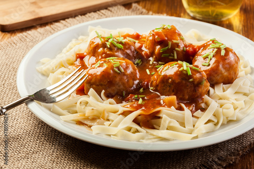 Pasta fettuccine and meatballs with tomato sauce