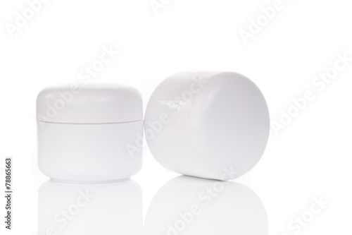 close up of beauty cream container on white background