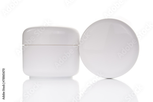 close up of beauty cream container on white background