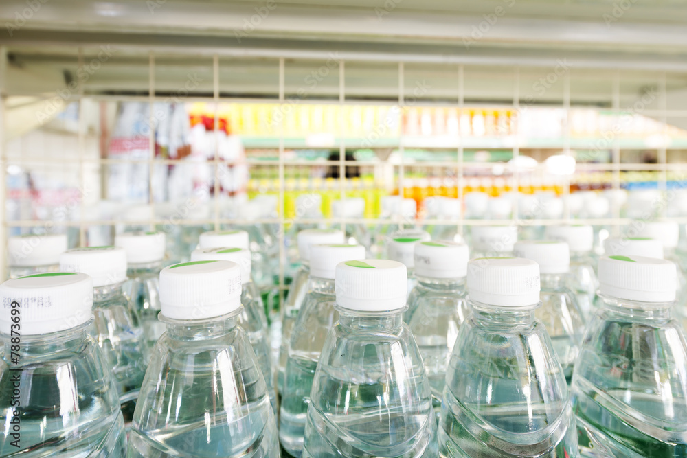 Many bottles of clean water with white lids Many bottles of clean water with white lids