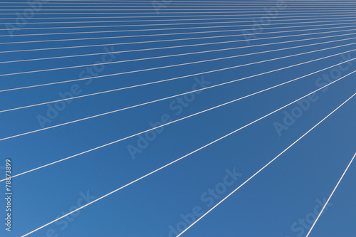 Steel cables over sky background. Abstract pattern.