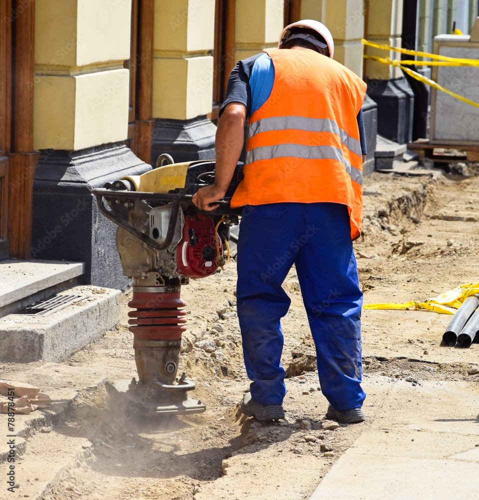 Man is working at the road construction Man is working at the road construction
